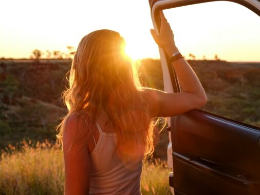 woman holding vehicle door